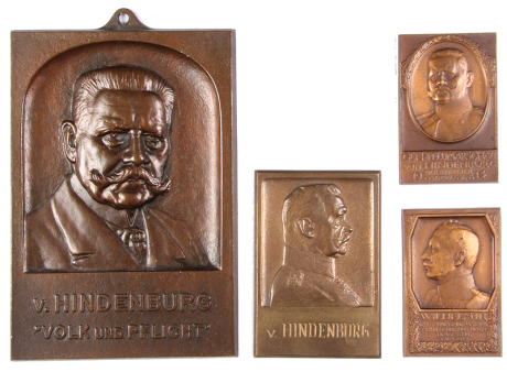 Four brass plaques, 2.6" to 5.8" ht., Wilhelm II [one] & v. Hindenburg [three], good condition.