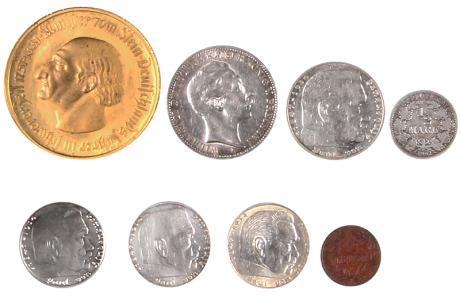 Eight German coins, 10000 Mark, 1923, Notgeld; Drei Mark, 1912, silver; 5 Mark, 1935, silver; 1/2 mark, 1907, silver; three coins, 2 Marks, 1939, silver; 1/2 Heller, Deutsches Ostafrika, 1904, good condition, but all show signs of wear, they have not been