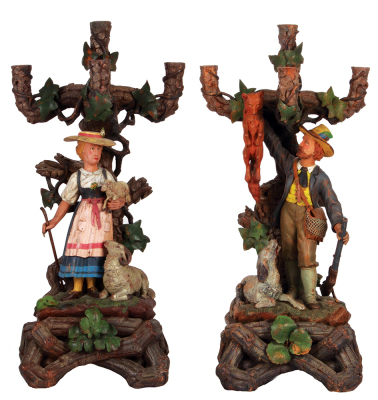 Pair Black Forest candelabras, 26.5" ht. x 12.6" w. x  10.0" D., carved in Germany, c. 1900, hunter with fox and dog, woman with baby and mother bock, both people in traditional clothing, carving and painting quality is very good, overall condition is exc