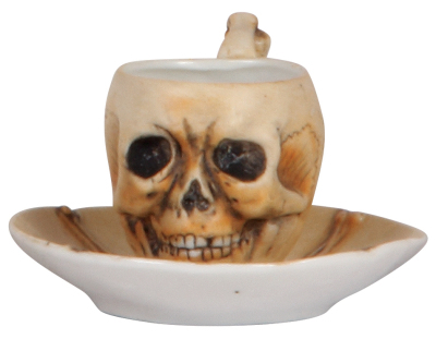 Porcelain cup & saucer, 3.8" d., unmarked, Skull, mint.
