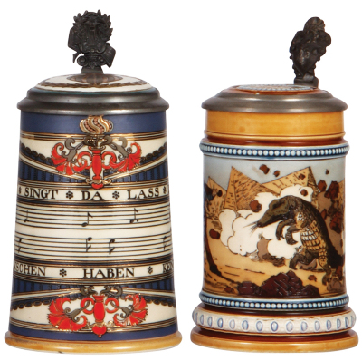 Two Mettlach steins, .5L, 2097, etched, by Otto Hupp, inlaid lid, inlay repaired; with, .5L, 1132, etched, inlaid lid, spider line under base, otherwise mint. 