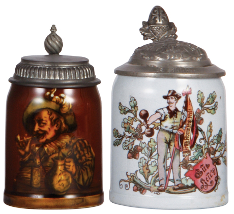 Two Mettlach steins, .25L, 6137 [2792], Rookwood, pewter lid, interior browning, otherwise mint; with, .5L, 662 [1526], PUG, Turner pewter lid, circular pewter tear, hairline. 