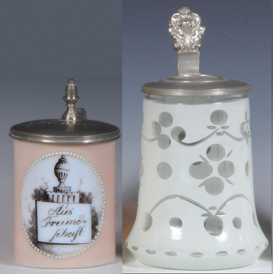 Two glass steins, .25L, blown, mid 1800s, milk glass with peach finish, verse: Aus Freundschaft, pewter lid, mint; with, .5L, blown, white enamel overlay on clear, cut, relief pewter lid, mint.