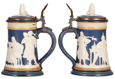Two Mettlach steins, .5L, 2182, relief, inlaid lid, some interior browning; with, .5L, 2358, relief, inlaid lid, some interior browning, two upper rim flakes.    - 3