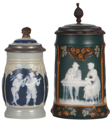 Two Mettlach steins, .3L, 2608, cameo, inlaid lid, mint; with, .5L, 2755, cameo, inlaid lid, pewter rim is rough, body mint.
