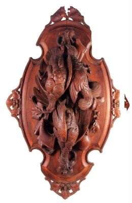 Black Forest game plaque, 37.0” x 23.5” x 5.5” deep, linden wood, made in Switzerland, c. 1900, excellent detailed carving, birds, flask, rifle and canteen, back plate has been split in center from drying and fall, some chips & a loose piece.