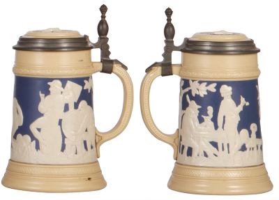 Two Mettlach steins, .5L, 1028 & 2182, relief, inlaid lids, 1028 has browning, 2182 has popped factory blister, otherwise mint. - 3