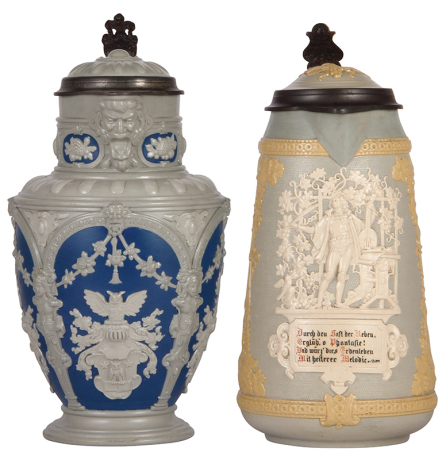 Two Mettlach steins, 3.0L, 13.2'' ht., 2076, relief, inlaid lid, pewter tear repair not complete, inlay crack, repair; with, 3.0L, 13.2'' ht., 1821, relief, inlaid lid, cracks repaired, some paint peeling.