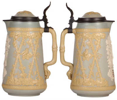 Two Mettlach steins, 3.0L, 13.2'' ht., 2076, relief, inlaid lid, pewter tear repair not complete, inlay crack, repair; with, 3.0L, 13.2'' ht., 1821, relief, inlaid lid, cracks repaired, some paint peeling. - 3