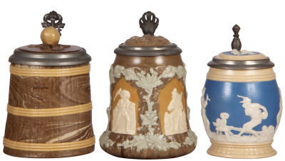 Three Mettlach steins, .5L, 468, Character, Barrel, inlaid lid, mint; with, .5L, 1467, relief, inlaid lid, 4" hairline in rear; with, .3L, 2211, relief, inlaid lid, mint.