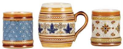 Three Mettlach items, match strike, 2.0'' ht., 1451, mosaic, interior browning; with, mustard, 2.6'' ht., 1273, mosaic, no lid; with, match strike, 2.0'' ht., 1461, mosaic, mint. - 2
