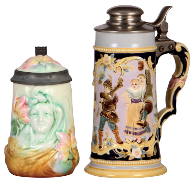 Two pottery steins, .5L, relief, majolica, Art Nouveau, inlaid lid, mint; with, .5L, by Rudolf Ditmar, majolica, metal lid, .5" hairline. 