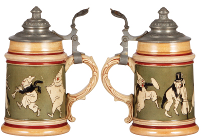 Two Pottery steins, .5L, etched, marked Reinhold Hanke, #1263, clowns, pewter lid, rare, mint; with, .5L, relief, 1278, by Reinhold Hanke, composers, inlaid lid, small glued chips on inlay edge.  - 2