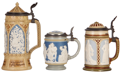 Three Mettlach steins, .5L, 228, relief, inlaid lid, line on bottom repaired, some paint flaking; with, .25L, 2086, relief, inlaid lid, small chip on inlay; with .3L, 2359, relief, inlaid lid, mint. - 2