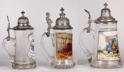 Three glass steins, .5L, transfer, Occupational Fleischer [Butcher], pewter lid, mint; with, .5L, transfer, Occupational Metzger [Butcher], pewter lid, mint; with, 1.0L, transfer, Occupational Schuhmacher [Shoemaker], pewter lid, flake on top rim. From th - 3