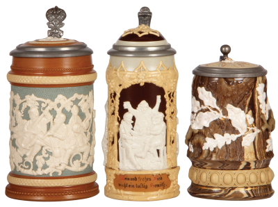 Three Mettlach steins, .5L, 485, relief, inlaid lid, mint; with, .5L, 1005, relief, inlaid lid, mint; with, .5L, 368, earlyware, inlaid lid, a little gold wear.