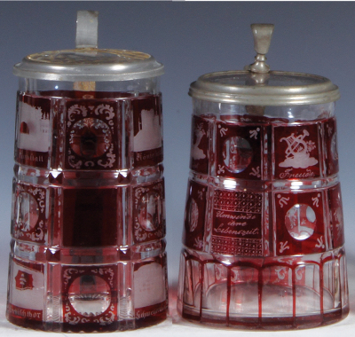 Two glass steins, .5L, blown, ruby flashed, spas, clear glass inlaid lid, mint; with, .5L, blown, ruby flashed, Umwinde ihre Lebenszeit, clear glass inlaid lid, mint. 