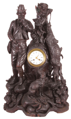 Black Forest Hunter clock, 29.6" x 18.3" x 10.5" deep, carved in southern Germany, detailed scene of Jäger, chamois and faithful dog, clock movement with enameled face appears to be French, Jäger missing one finger and hat brim, one chamois leg missing, o