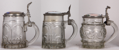 Three glass steins, .5L, mold blown, porcelain inlaid lids, second has a small chip at the bottom of the handle, normal wear, good condition. - 2