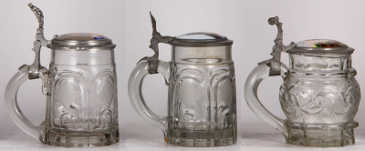 Three glass steins, .5L, mold blown, porcelain inlaid lids, second has a small chip at the bottom of the handle, normal wear, good condition. - 3