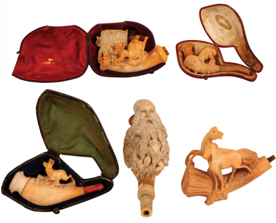 Five Meerschaum pipe bowls, 3" to 5" long, three with cases, some with small chips.