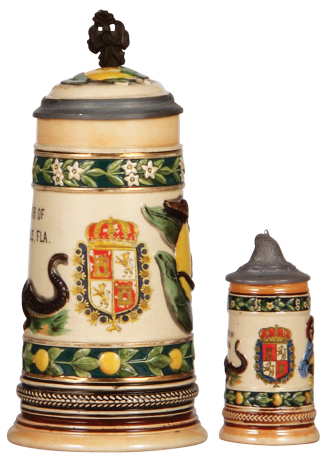 Two pottery steins, .5L, transfer & relief, Souvenir of Jacksonville, FLA., inlaid lid, small flake on band; with, 4.2" ht., relief, Souvenir of Florida, very good condition.