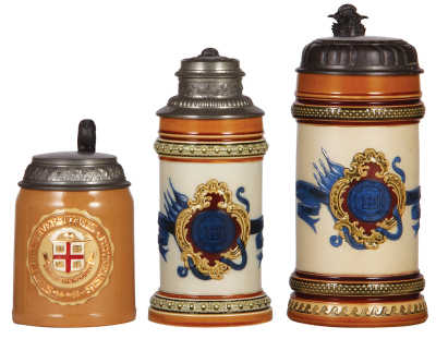 Three Mettlach steins, .5L, 2772, relief, Brown University, pewter lid, mint; with, .5L, 1163, decorated relief, Yale University, pewter lid, mint; with, 1.0L, 1154, decorated relief, Yale University, pewter lid, mint.