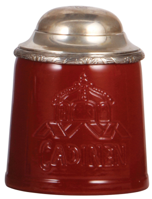 Stoneware stein, .5L, marked Cadinen, red glaze, incised crown & Cadinen, silver lid, mint.