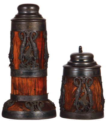 Two wood steins, metal mounts, St. Louis Silver Co., 1.0L, silver-plating worn, missing lower portion of overlay; with, .5L, silver-plating is worn.
