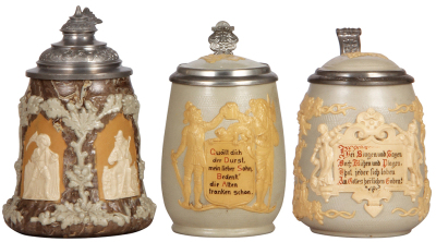 Three Mettlach steins, .5L, relief, 1467, 2943, 1370, first has a pewter lid, others have inlaid lids, all mint.