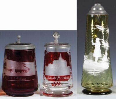 Three glass steins, .5L, blown, ruby flashed, wheel-engraved: Coblenz, clear glass inlaid lid, minor wear; with, 5.3" ht., blown, ruby flashed, wheel-engraved: Schloss Friedland, clear glass inlaid lid, mint; with, 13.5" ht., blown, amber, young girl, Mar