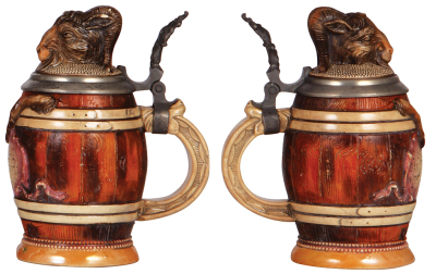 Two Character steins, 1.0L, 9.4" ht., pottery, marked Sarreguemines, Majolica, Man, pewter lid, glaze browning, otherwise mint; with, .5L, pottery, by Diesinger, 700, Bock in Barrel, small chip & line. - 5