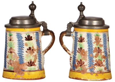 Three faience steins, 7.7" ht. to 9.2" ht., 1800s, pewter lids and first two have footrings, they display well, but first  has wear [cold-fired] and a 2" chip glued back in place, second in good condition, third has heavy glaze loss inside and outside.  - 7