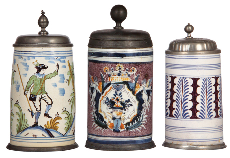 Three faience steins, 8.9" ht. to 10.2" ht., late 1700s, pewter lids and footrings, they display well, but all have multiple hairlines or cracks and some glaze flakes. 