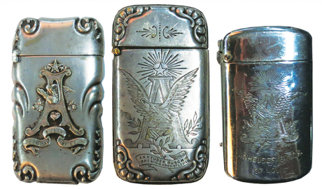 Three Anheuser Busch match safes, sizes 1.5" x 2.7", two engraved, one relief, marked sterling, good used condition.