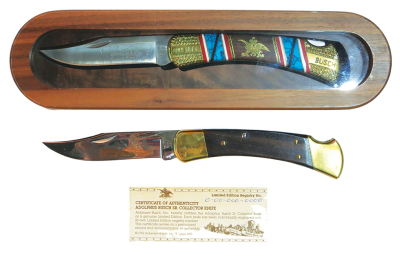 Two Anheuser Busch pocket knives, 10" display case, Hensley & Co. Wholesale Sales Buck Knife, signed on reverse; with, 8.9", Adolphus Busch Buck Knife, Collector Ed., serial number 0-00-000-0000, both in excellent condition.