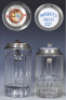 Two glass steins, .5L, pressed, porcelain inlaid lid: Pilsner Brewing Co., Olympia, pewter dents; with, .5L, pressed, porcelain inlaid lid: Imported Beer 20&cent;, pewter dent, otherwise mint.