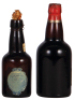 Four Anheuser-Busch bottles, 7.4" to 7.9" ht., paper labels include: Bevo A Beverage Non-Intoxicating, Bevo A Beverage Non-Intoxicating, Malt-Nutrine Non Intoxicant, Malt-Nutrine bottle is unopened, good used condition, having minimal flaws and wear. - 3