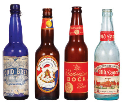 Four Anheuser-Busch bottles, 9.4" to 9.8" ht., paper labels include: Liquid Bread, Muenchener Munich Style Amber, Budweiser Bock Beer, Anheuser-Busch Old Lager Beer, good used condition, having minimal flaws and wear.