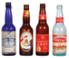 Four Anheuser-Busch bottles, 9.4" to 9.8" ht., paper labels include: Liquid Bread, Muenchener Munich Style Amber, Budweiser Bock&nbsp;Beer, Anheuser-Busch Old Lager Beer, good used condition, having minimal flaws and wear.