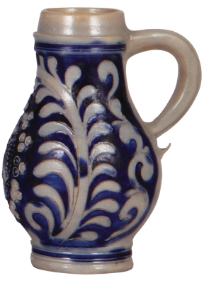 Stoneware stein, 6.2'' ht., early 1700s, Westerwälder Birnkrug, applied relief & incised, blue saltglaze, handle repaired. - 2