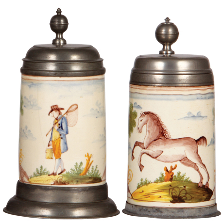 Two Faience steins, 10.2" ht., c.1770, Magdeburger Walzenkrug, pewter lid & footring, inscription on lid 1811, 4" hairline; with, 9.6" ht. c.1770, Magdeburger Walzenkrug, pewter lid with touch marks & pewter footring, two 3" hairlines.