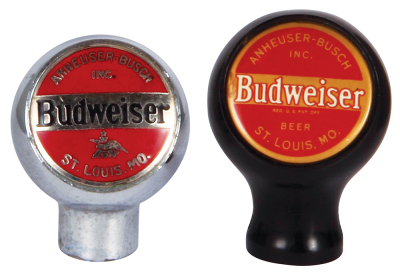 Two Anheuser-Busch tap knobs, 2.5" ht., chrome, Budweiser; with, 2.7" ht., black plastic Budweiser, A & Eagle on reverse, a little pitting, otherwise very good condition.