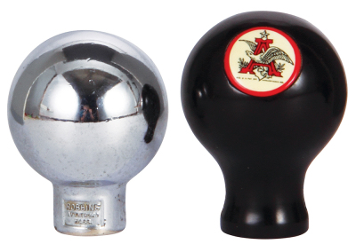 Two Anheuser-Busch tap knobs, 2.5" ht., chrome, Budweiser; with, 2.7" ht., black plastic Budweiser, A & Eagle on reverse, a little pitting, otherwise very good condition. - 2