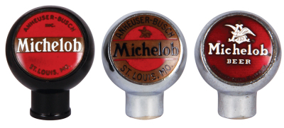 Three Anheuser-Busch tap knobs, 2.6" ht., black plastic, Michelob, enamel on brass; with,  2.5" ht., chrome, enamel on brass, Michelob; with, 2.5" ht., chrome, Michelob, enamel, Michelob on reverse; good used condition.