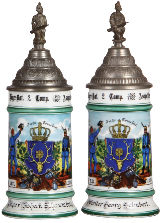 Two Regimental steins, .5L, 10.8" ht., porcelain, bayr. 2. Comp., 2. Jäger Bat., Aschaffenburg, 1900 - 1902, two side scenes, rosters, lion thumblifts, named to: Jäger Johann Schaumberg & Gefreiter Georg Schubert, 2nd. has lithophane lines, otherwise both