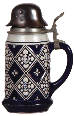 Third Reich stein, 1.0L, stoneware, marked 2694, relief, blue glaze, pewter lid with large cast metal helmet finial with eagle and swastika, very good condition.