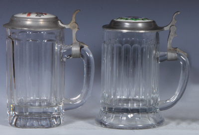 Two glass steins, .5L, pressed, clear, pressed, porcelain inlaid lid: Jung Bräu Milwaukee's Finest, base chip; with pressed, clear, porcelain inlaid lid: Old Lager, Joliet Citizens Brewing Co., Joliet, IL., mint. - 2