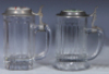 Two glass steins, .5L, pressed, clear, pressed, porcelain inlaid lid: Jung Br&auml;u Milwaukee's Finest, base chip; with pressed, clear, porcelain inlaid lid: Old Lager, Joliet Citizens Brewing Co., Joliet, IL., mint. - 2