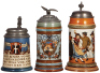 Three Mettlach steins, .5L, etched, 2002, relief pewter lid, hairline on inside at bottom; .5L, etched, 2006, old replaced pewter lid, body mint; .5L, 1655, music box base [without music box], original pewter lid, mint.&nbsp;&nbsp;